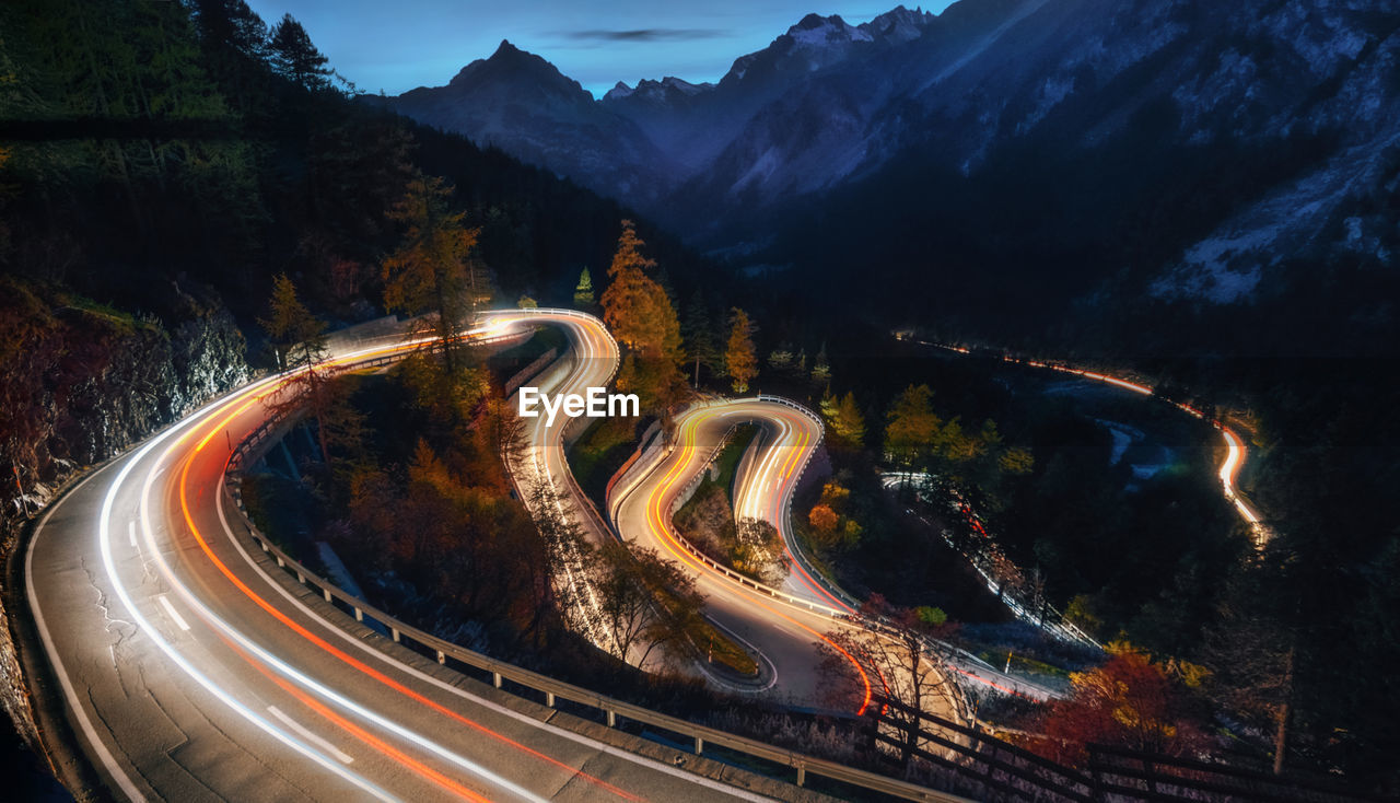 High angle view of light trails on road at night