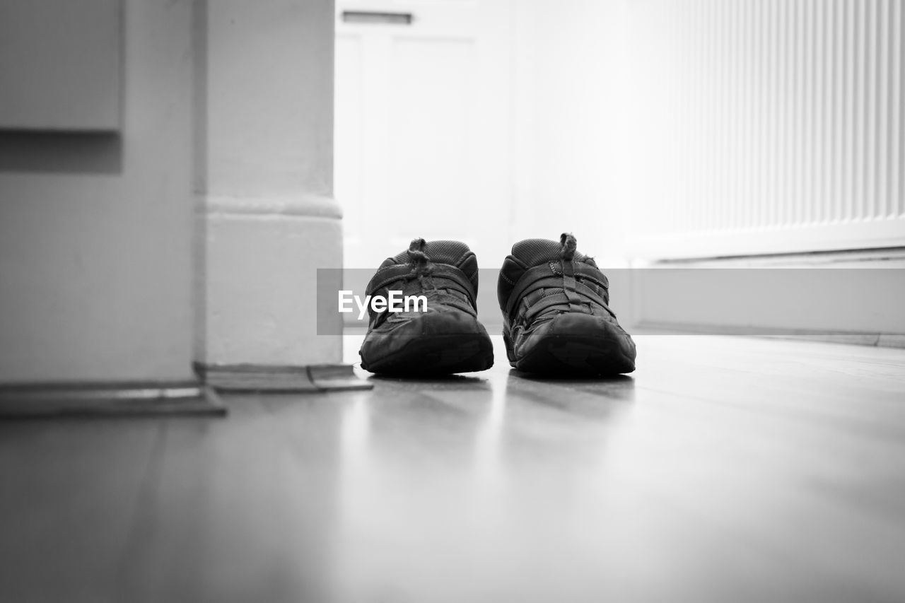 CLOSE-UP OF SHOES ON SHELF