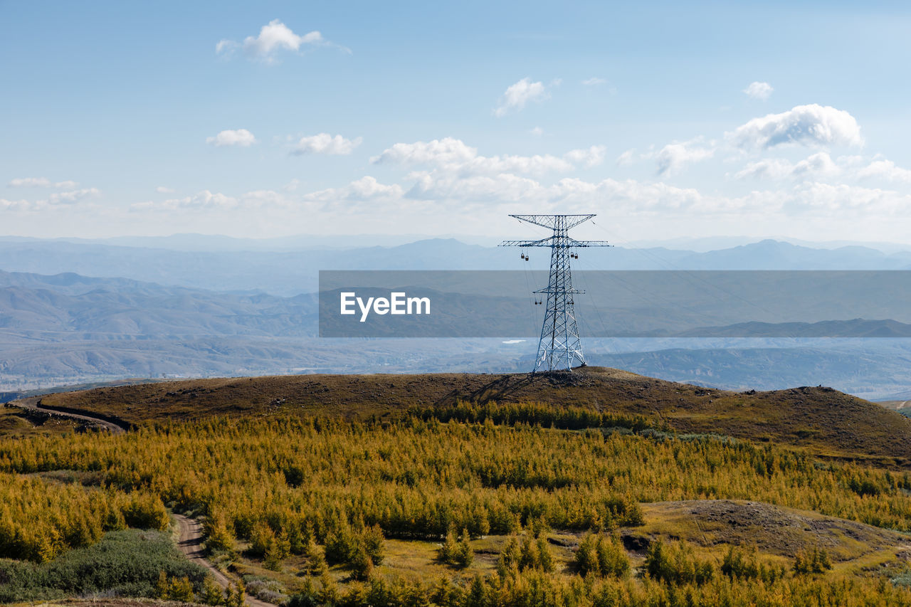 High voltage electric transmission, high voltage pylon in the mountains