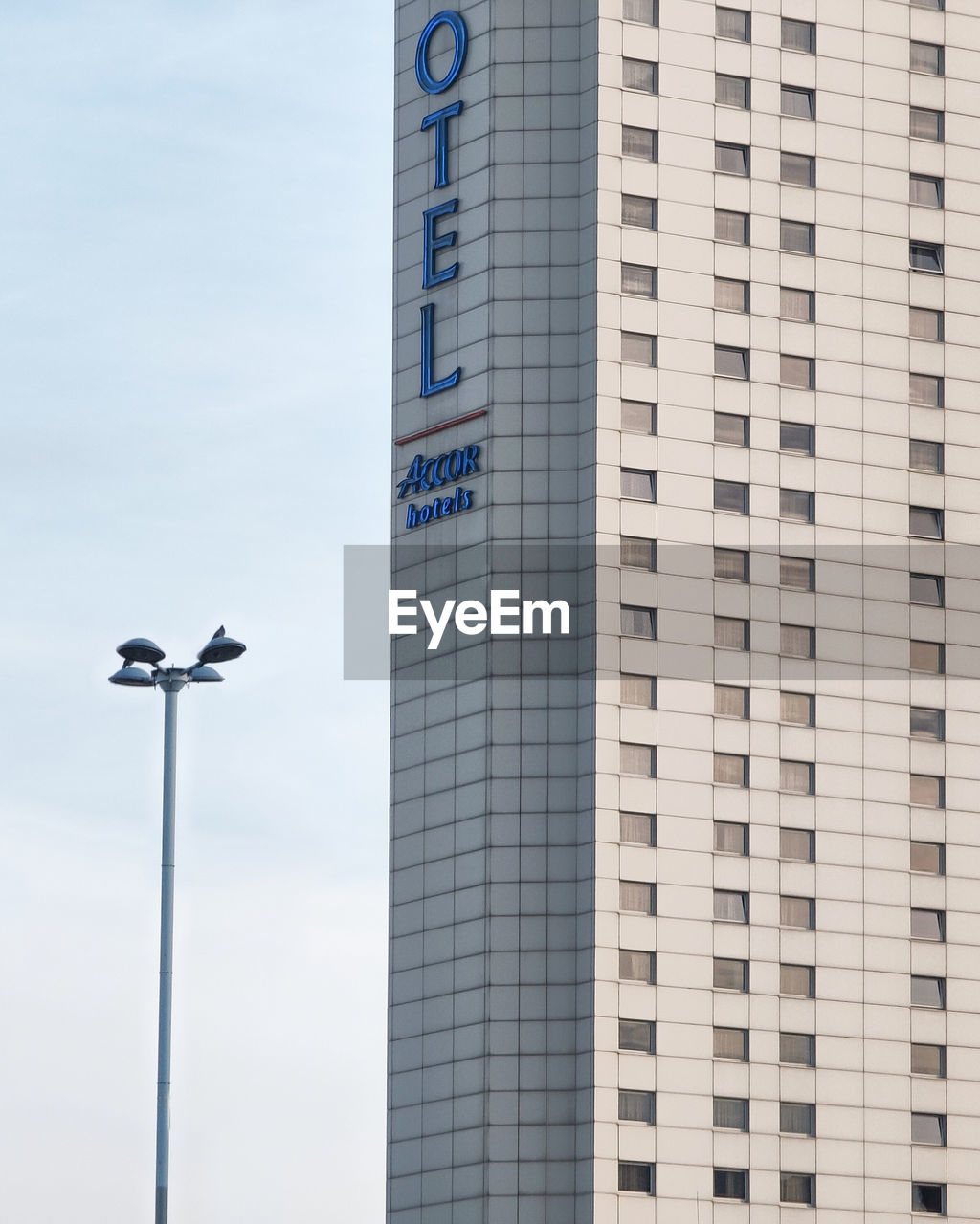 LOW ANGLE VIEW OF A AIRPLANE FLYING IN BUILDING