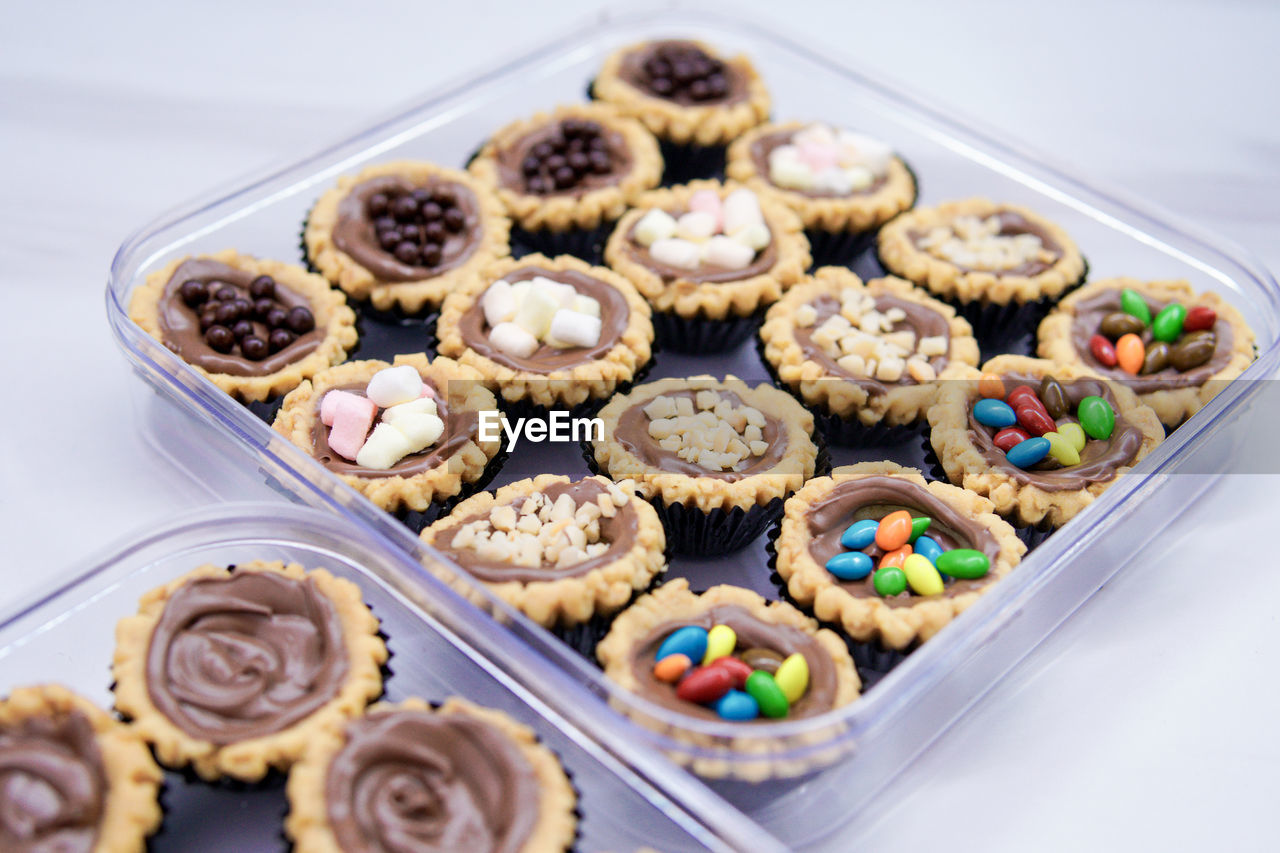 Cheese tart, chocolate tart, and various types of tarts are served to be eaten on eid.