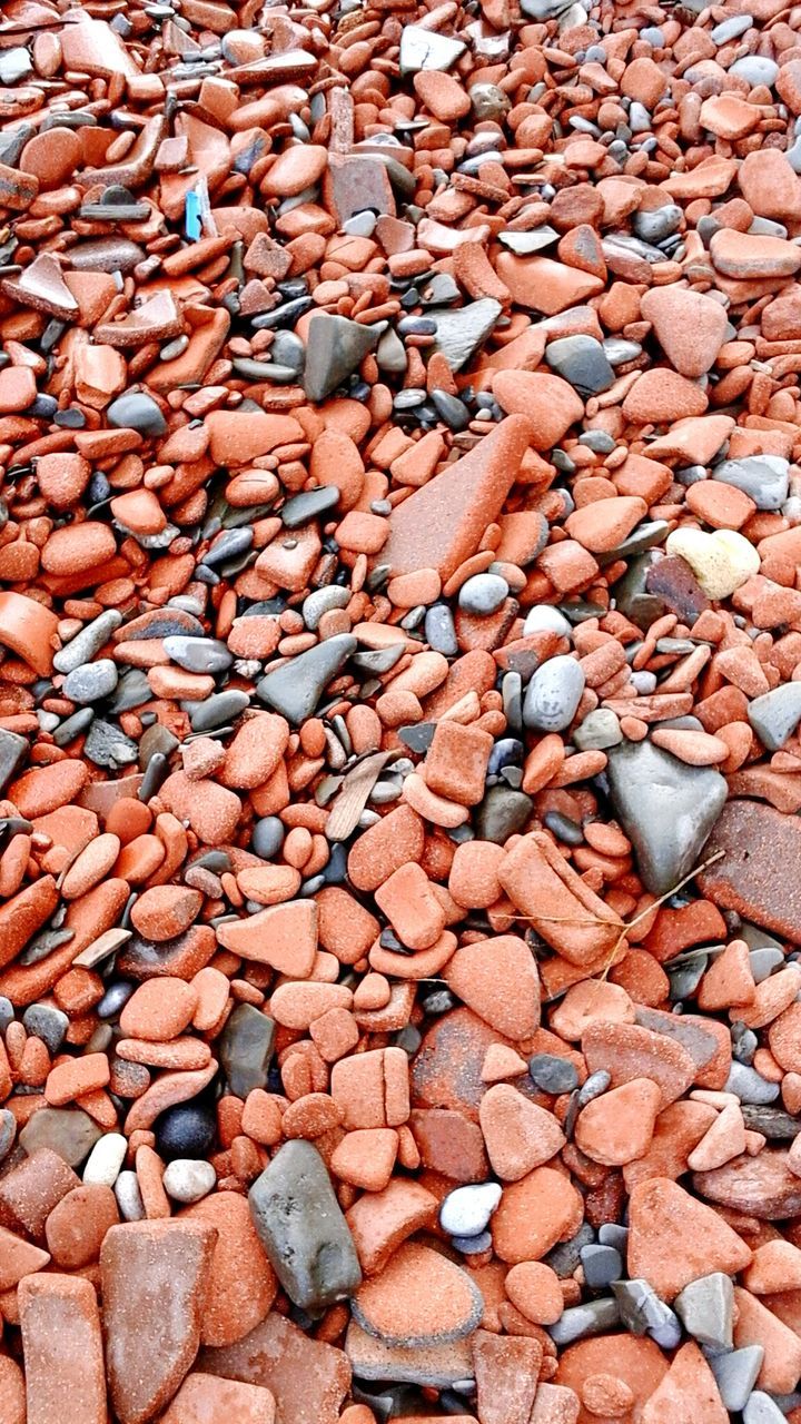 Full frame shot of orange stones