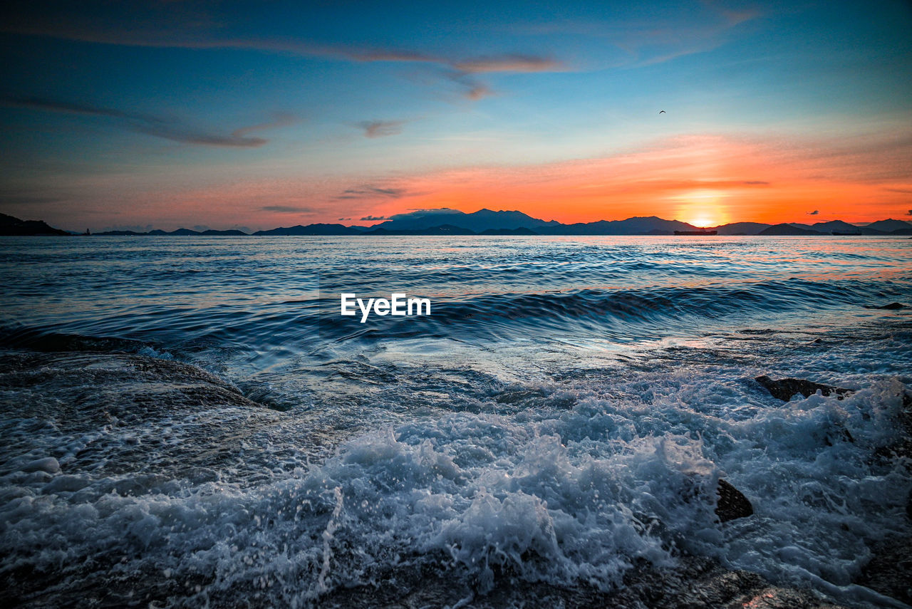 Scenic view of sea against sky during sunset