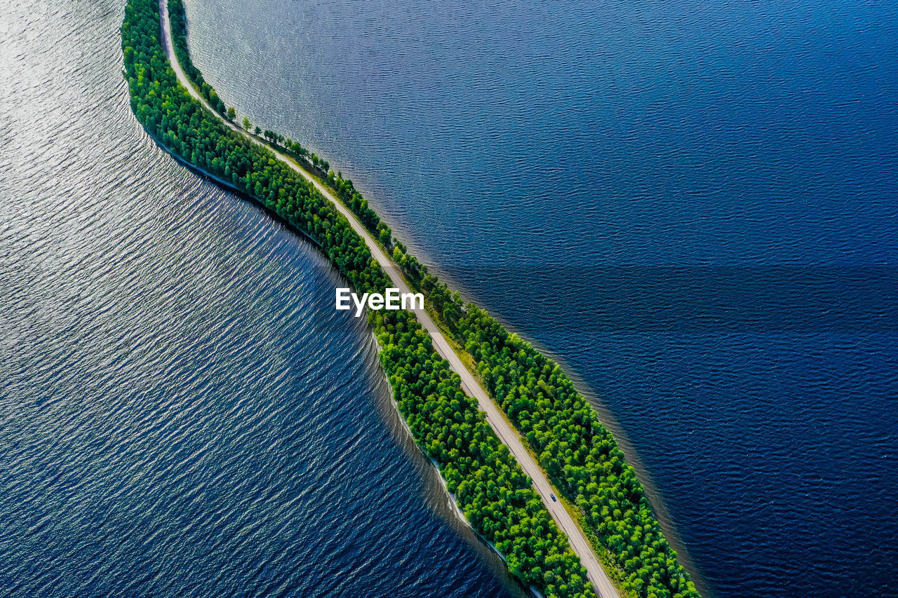 Aerial view of a road in the middle of a lake in finland