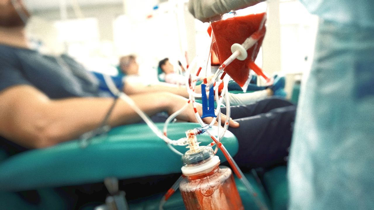 People donating blood at hospital