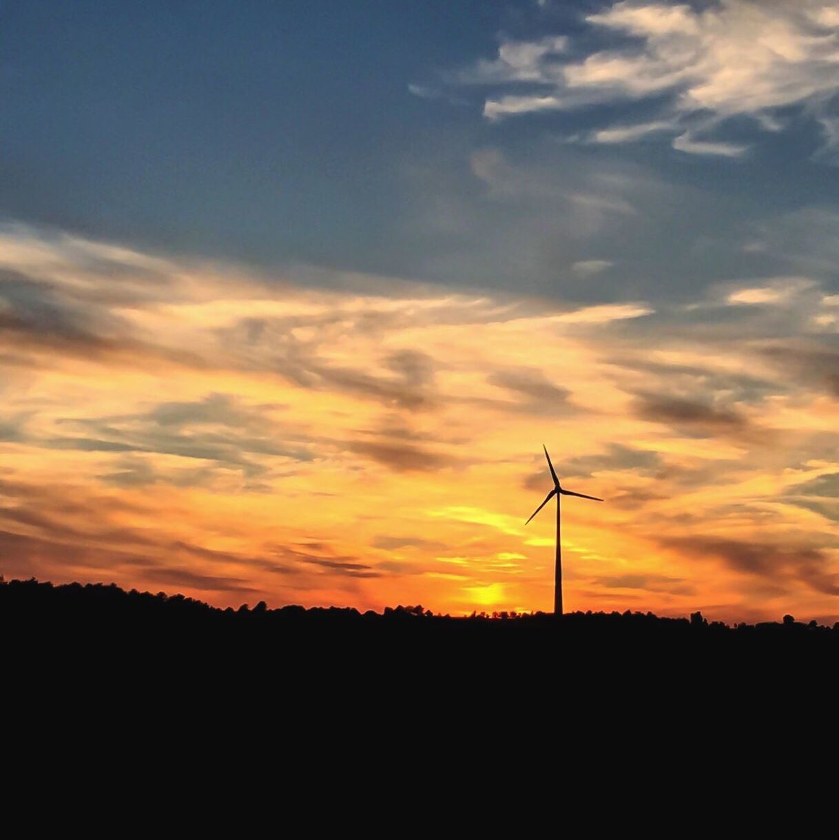 SUNSET OVER LANDSCAPE