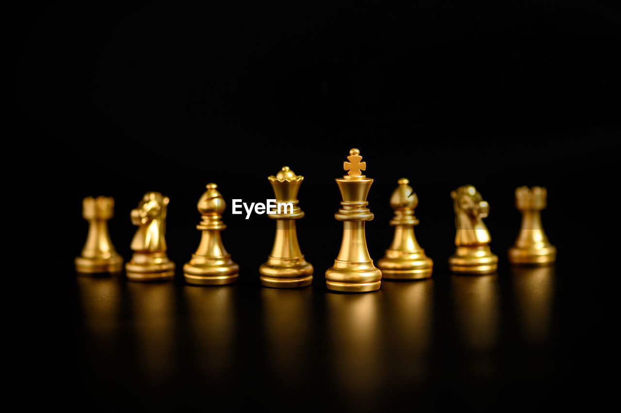 CLOSE-UP OF CHESS PIECES ON TABLE