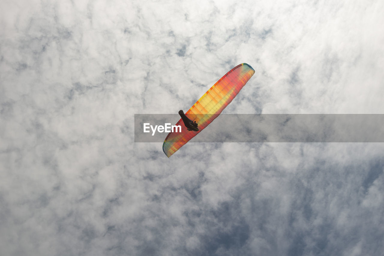 Low angle view of kite flying against sky