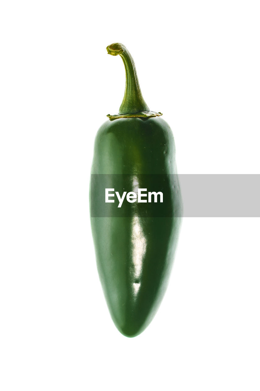 Close-up of green jalapeno pepper over white background