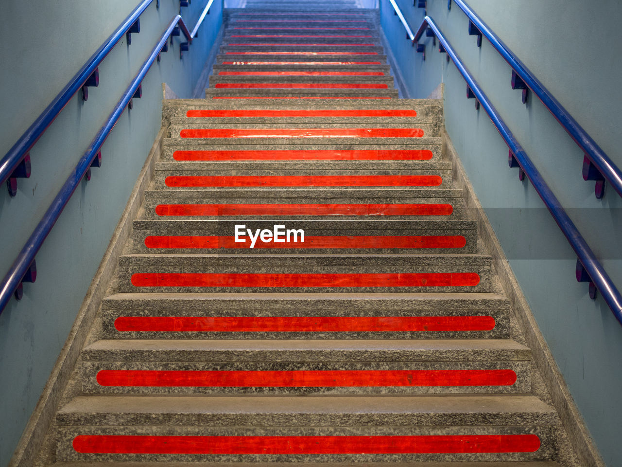 HIGH ANGLE VIEW OF STEPS AND ILLUMINATED STAIRCASE