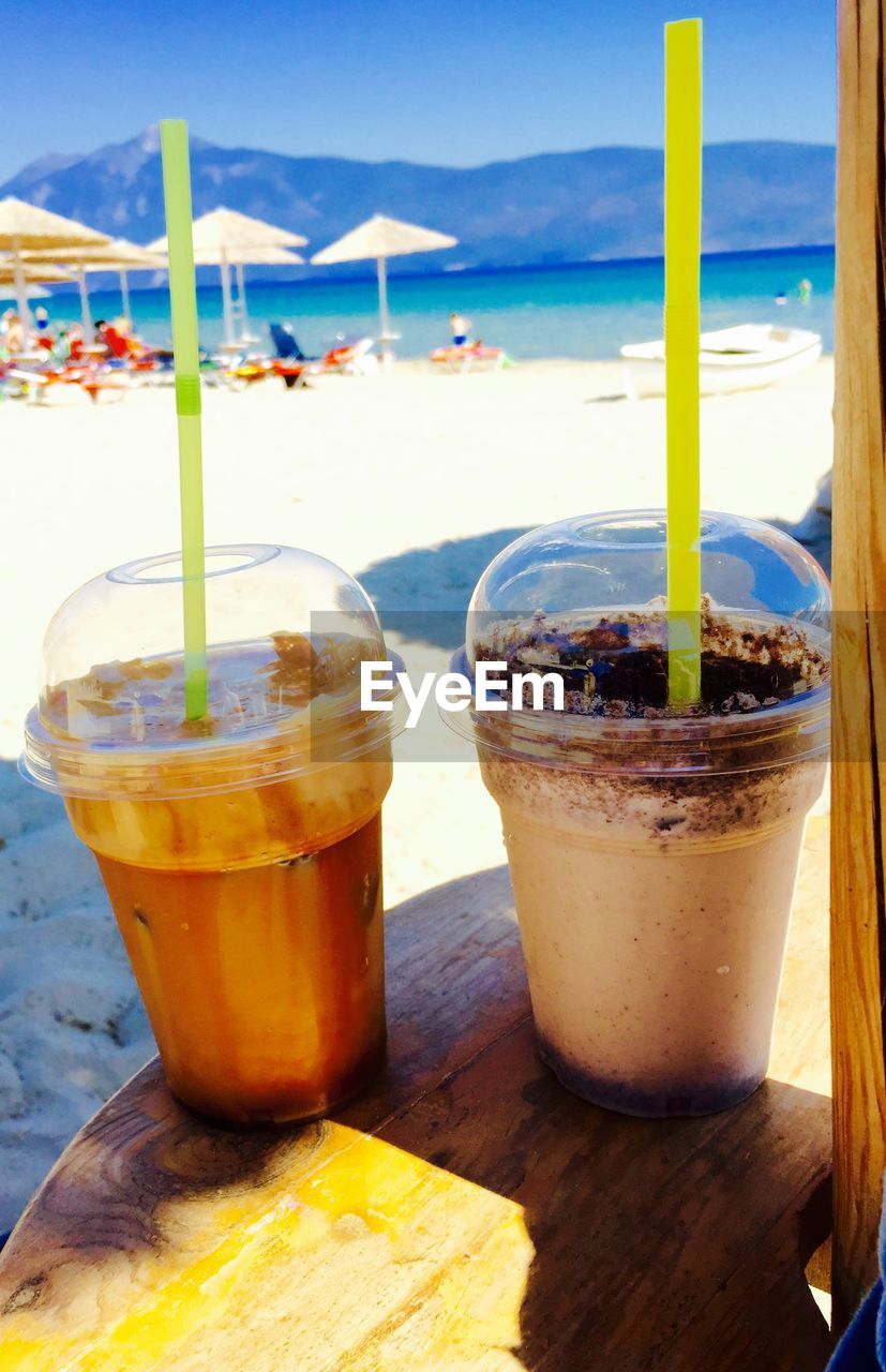 CLOSE-UP OF DRINK ON TABLE