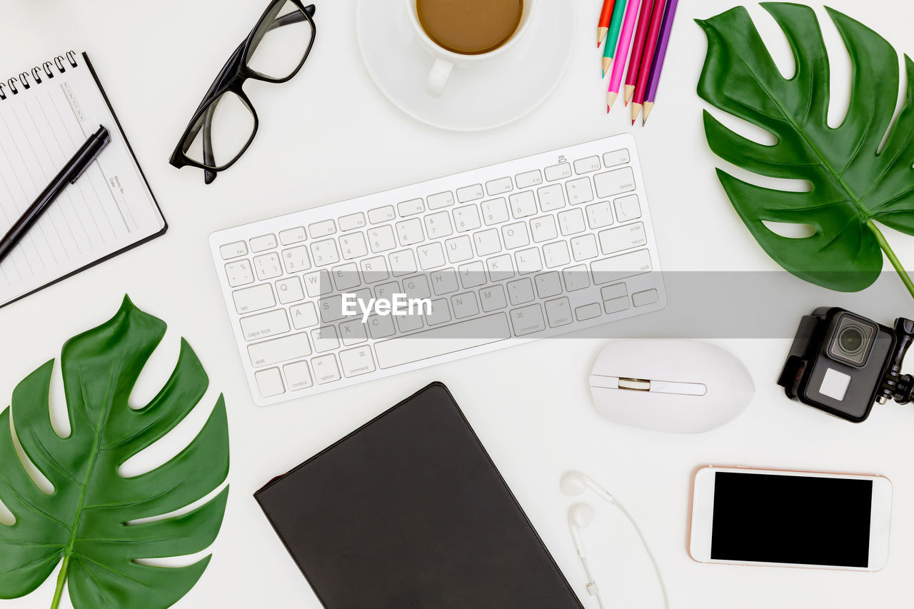 High angle view of various objects on desk in office