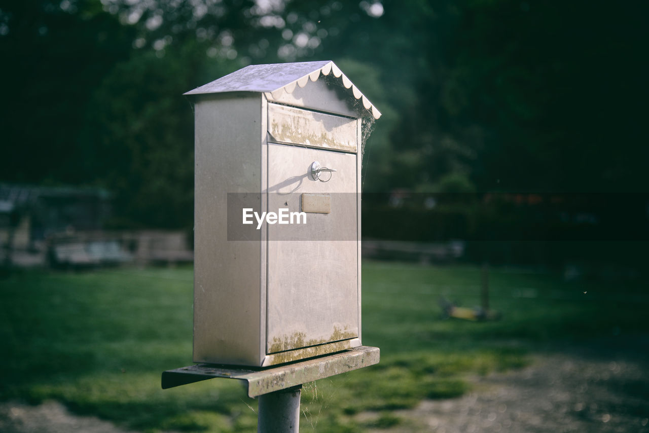 Vintage posta mailbox with coutryside background