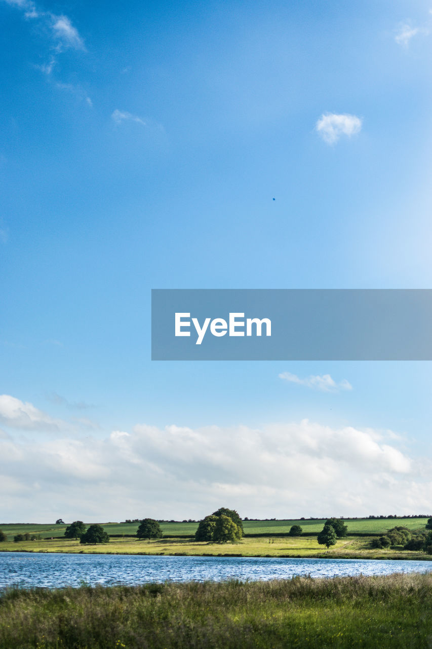 VIEW OF TRANQUIL SCENE OF LANDSCAPE AGAINST SKY