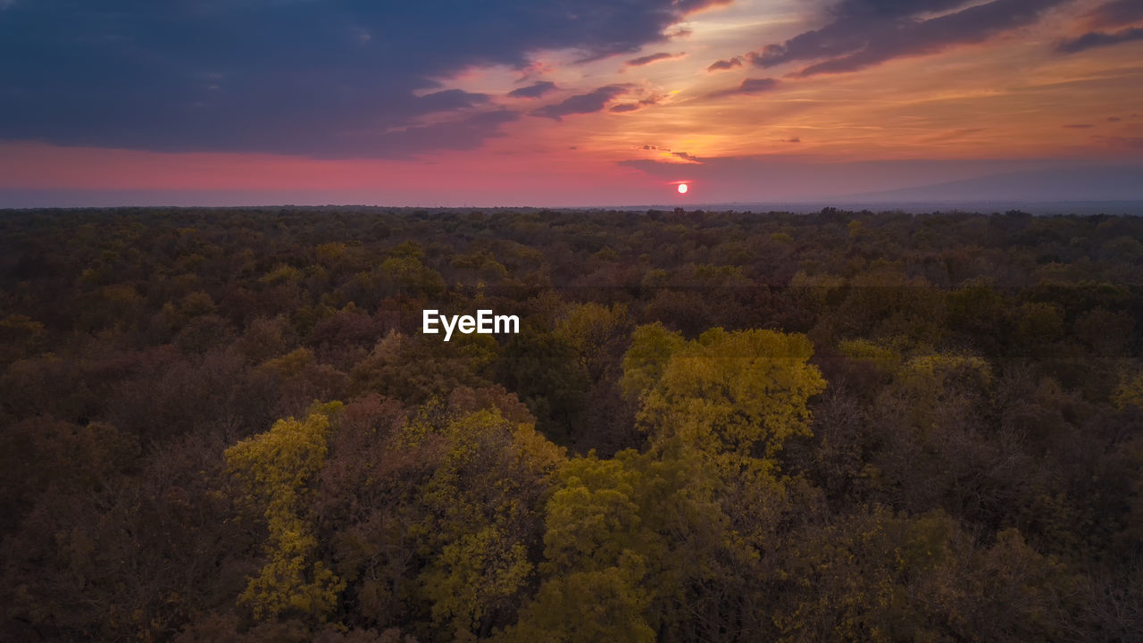 SCENIC VIEW OF DRAMATIC SKY DURING SUNSET