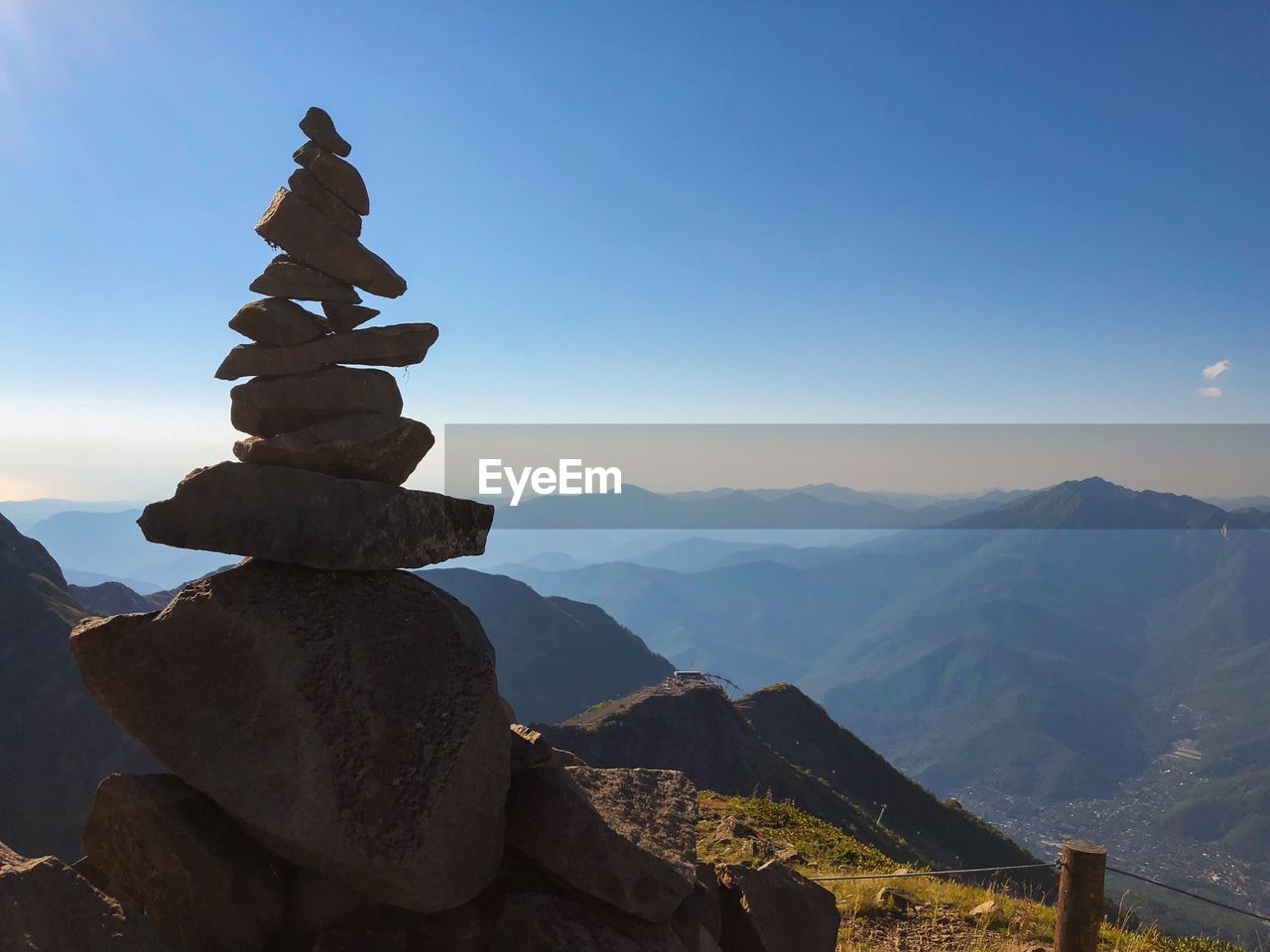 STACK OF ROCKS AGAINST MOUNTAINS