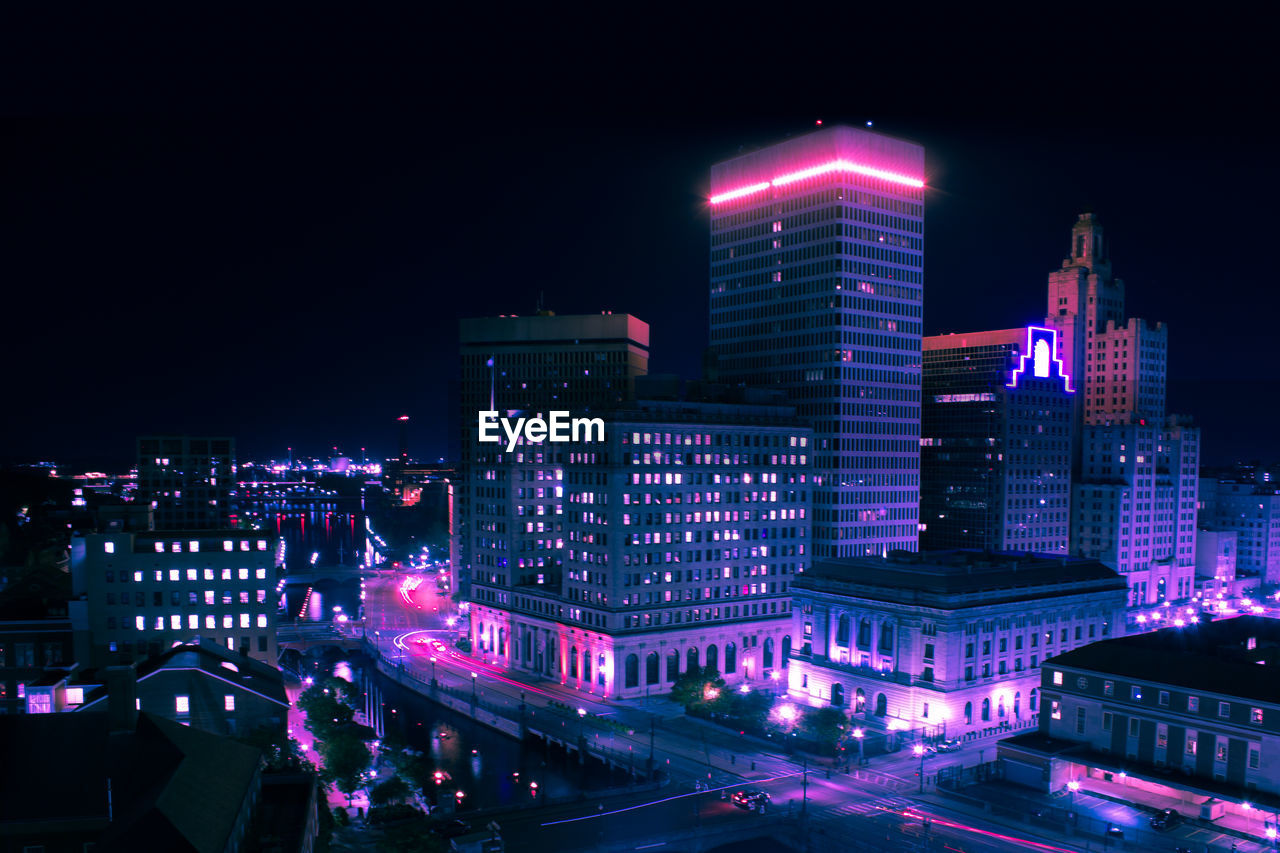 HIGH ANGLE VIEW OF BUILDINGS AT NIGHT