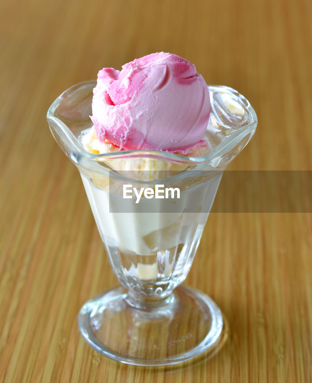 ICE CREAM IN GLASS ON TABLE