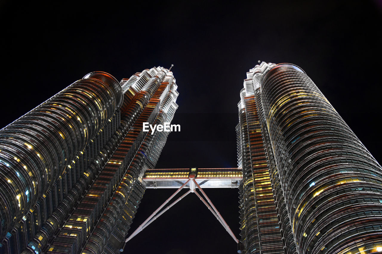 Spires of the petronas twin towers with cloudy background during a rainy day