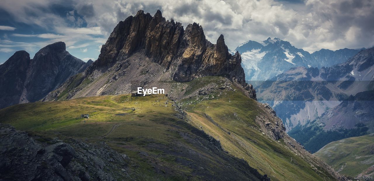 Panoramic view of rocky mountains against sky