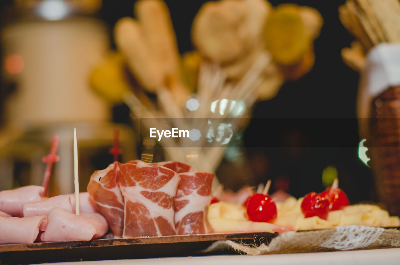 CLOSE-UP OF SWEET FOOD SERVED ON TABLE