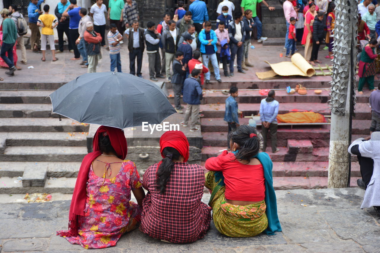 Women sitting outside the temple, nepal