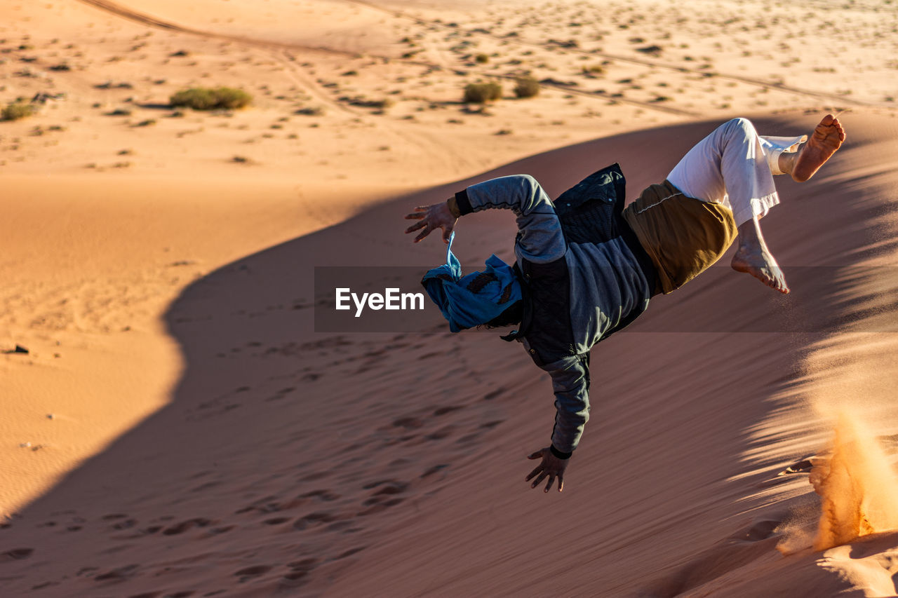 FULL LENGTH OF CHILD ON SAND DUNE