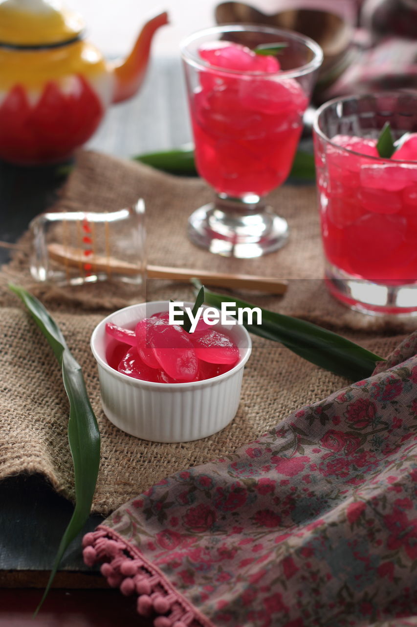 High angle view of preserved sweet palm fruit in glass on table