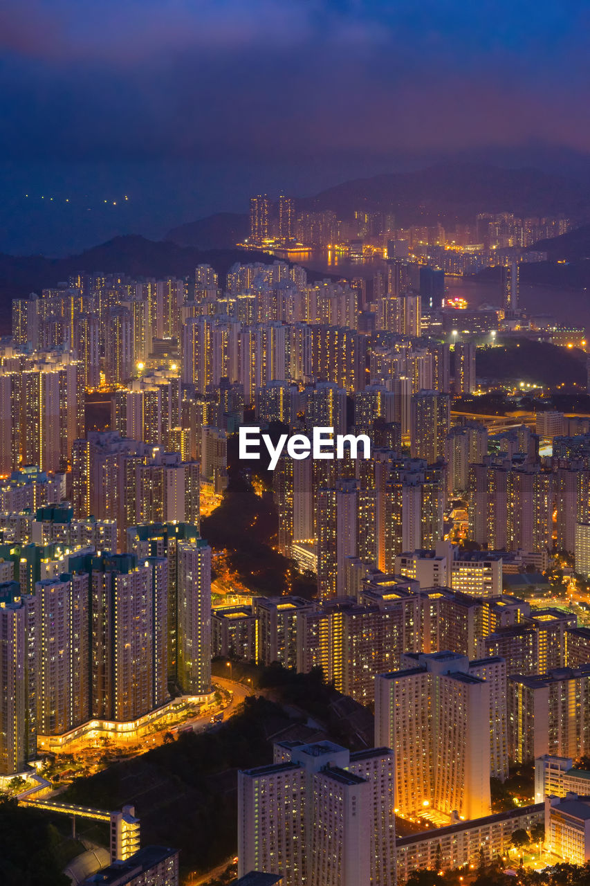 Aerial view of illuminated buildings in city at night