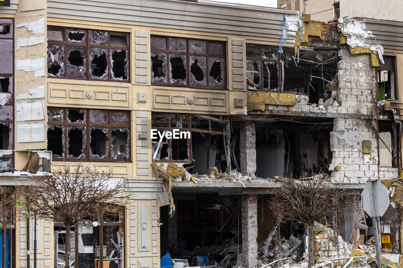 Destroyed buildings on the streets of irpen. broken windows. buildings after being hit by missiles.