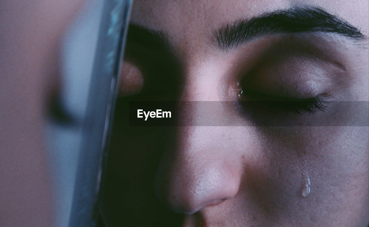 Close-up of young woman crying
