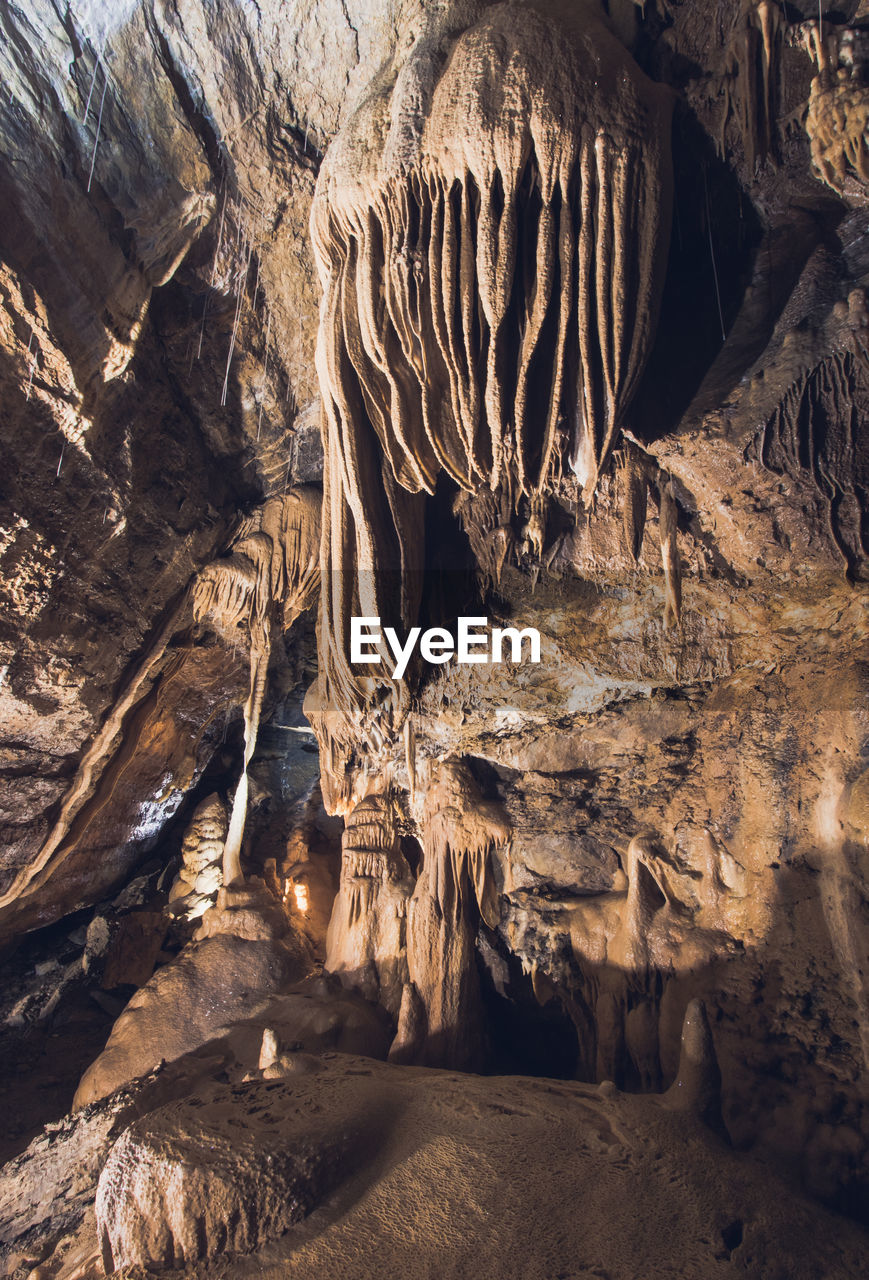 rock, geology, nature, rock formation, no people, beauty in nature, cave, environment, physical geography, landscape, non-urban scene, land, travel destinations, outdoors, scenics - nature, mountain, eroded, tranquility, stalactite, travel, extreme terrain, formation, pattern, day, stalagmite