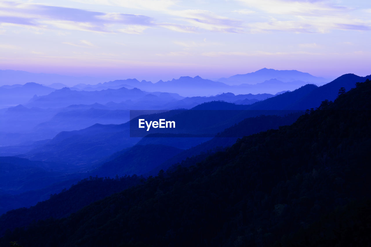 Scenic view of mountains against dramatic sky