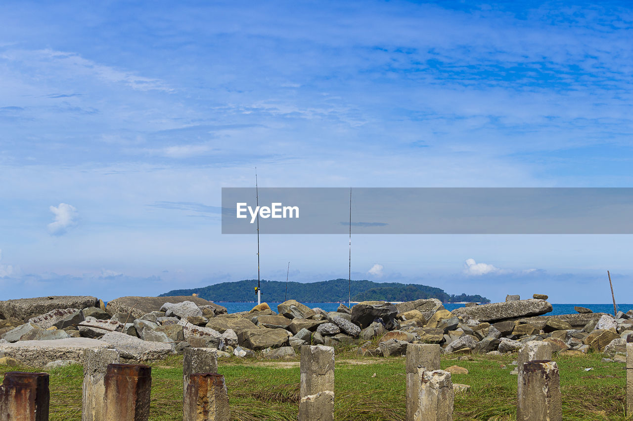 sky, nature, cloud, sea, environment, land, no people, landscape, water, day, architecture, blue, fence, scenics - nature, beauty in nature, outdoors, tranquility, coast, built structure, environmental conservation, tranquil scene, wood, hill, travel, non-urban scene, rural scene, rural area