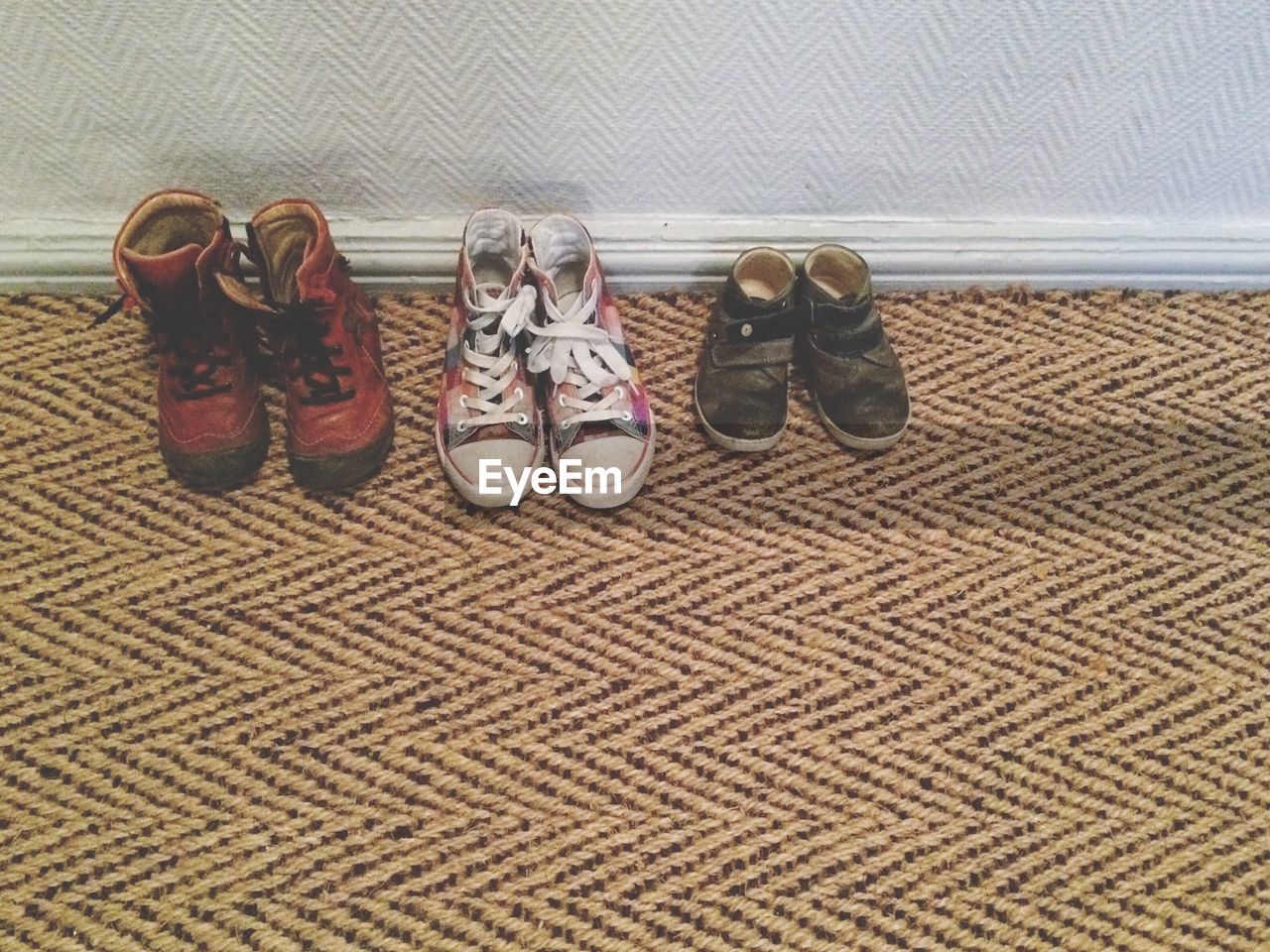 High angle view of shoes kept on mat