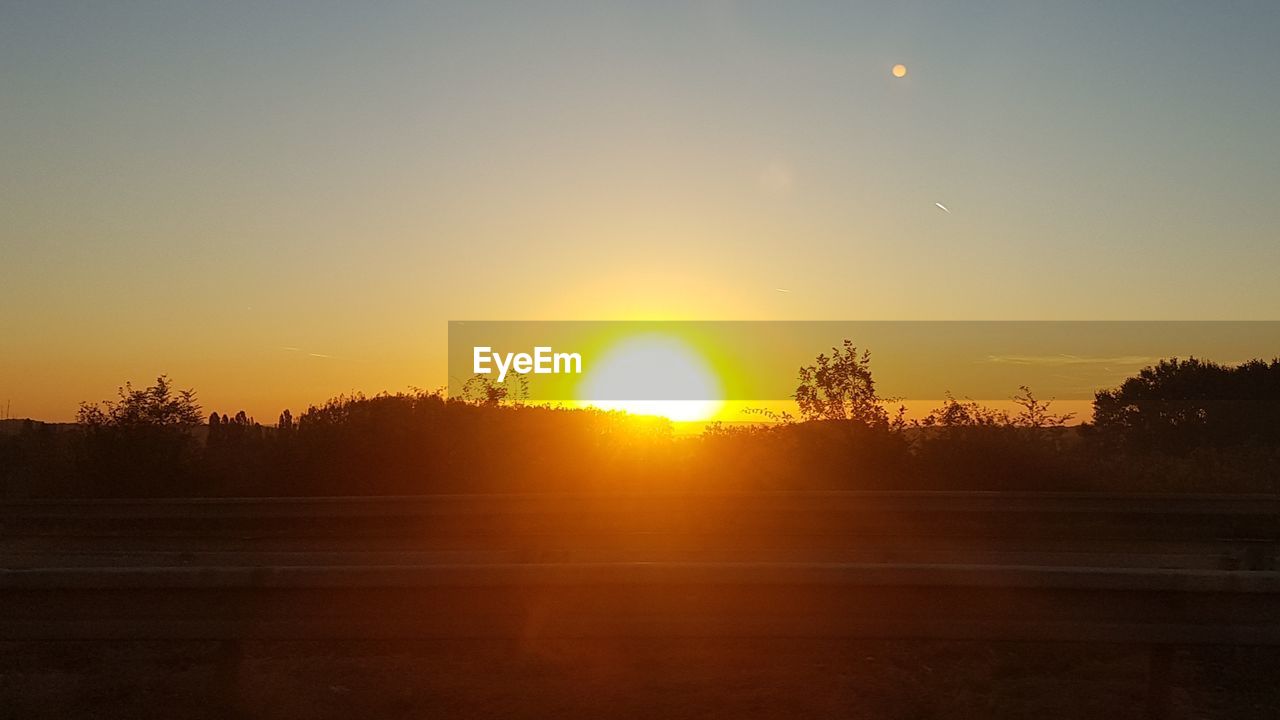 SCENIC VIEW OF SUNSET AGAINST SKY