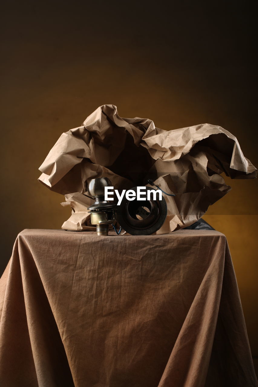 CLOSE-UP OF GARBAGE ON TABLE