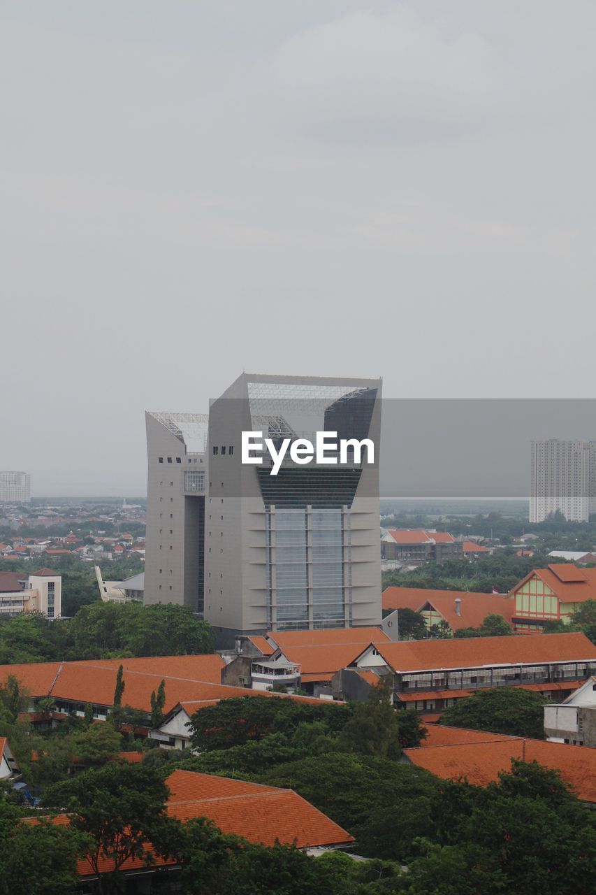 High angle view of buildings in city against sky