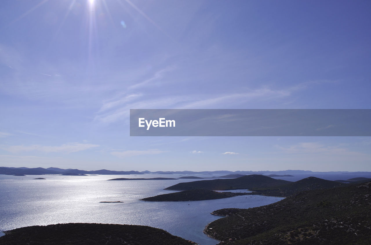 Scenic view of mountain against cloudy sky