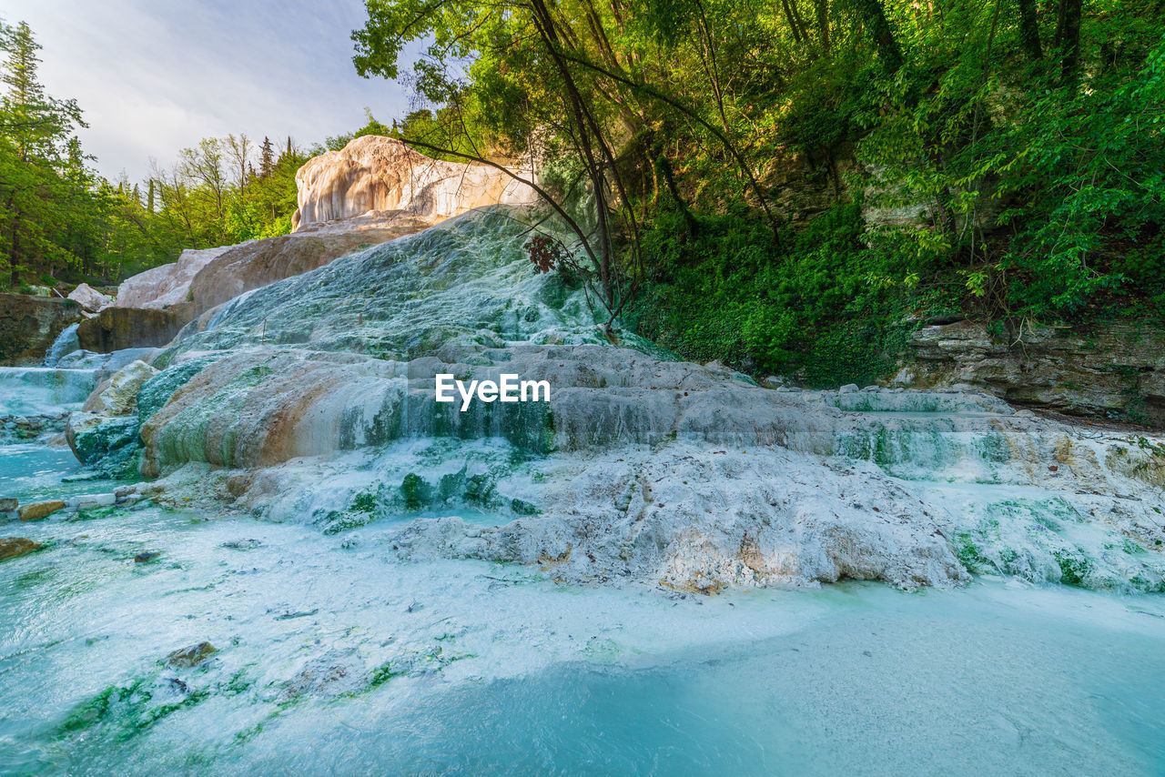 scenic view of waterfall against sky