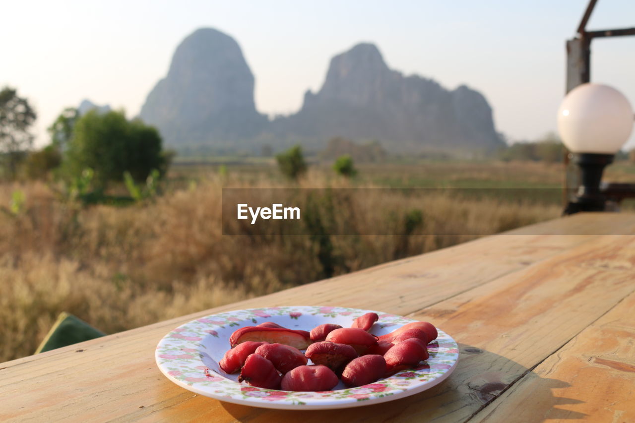 Fruits in bowl on table