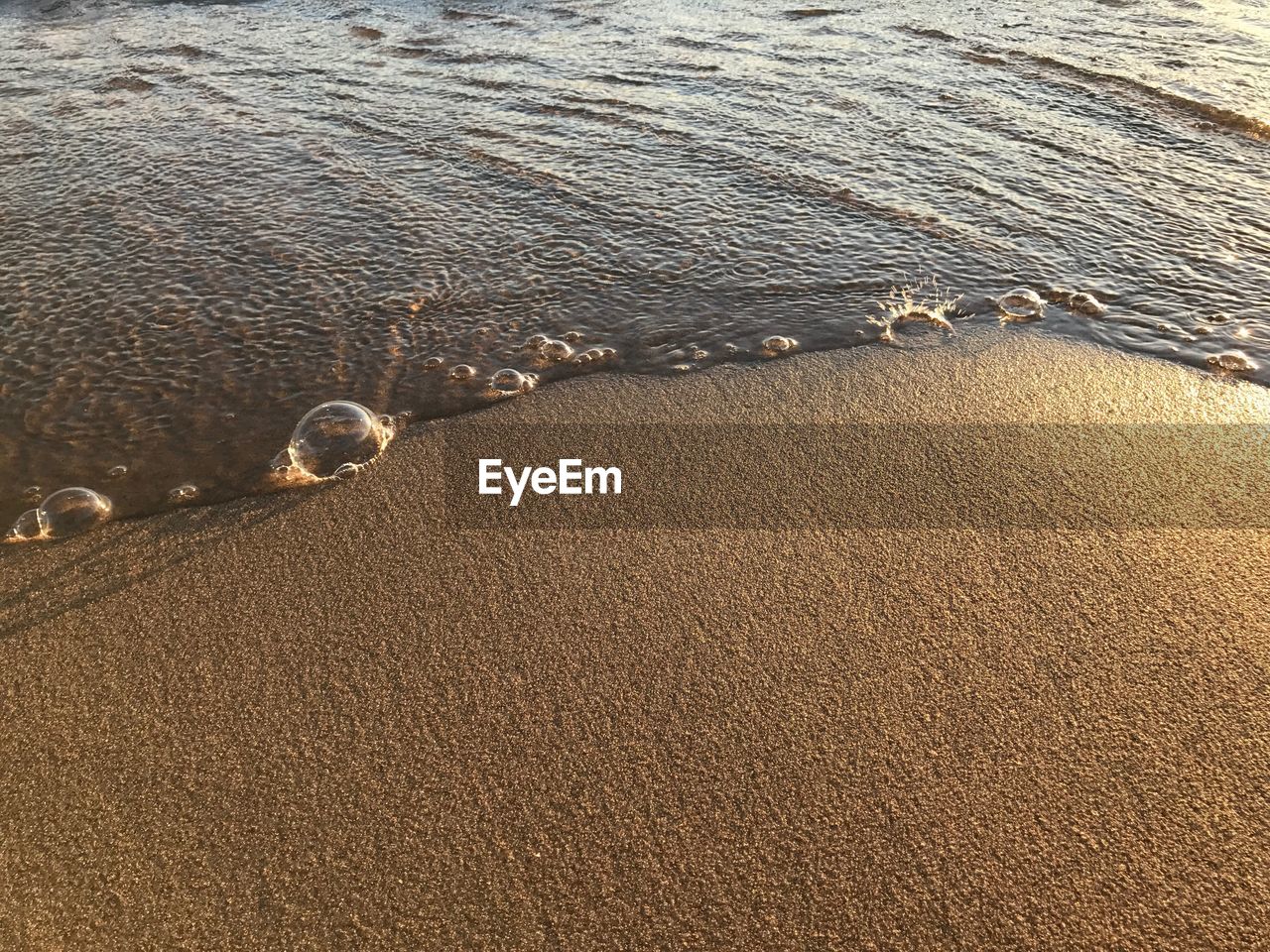 HIGH ANGLE VIEW OF SAND