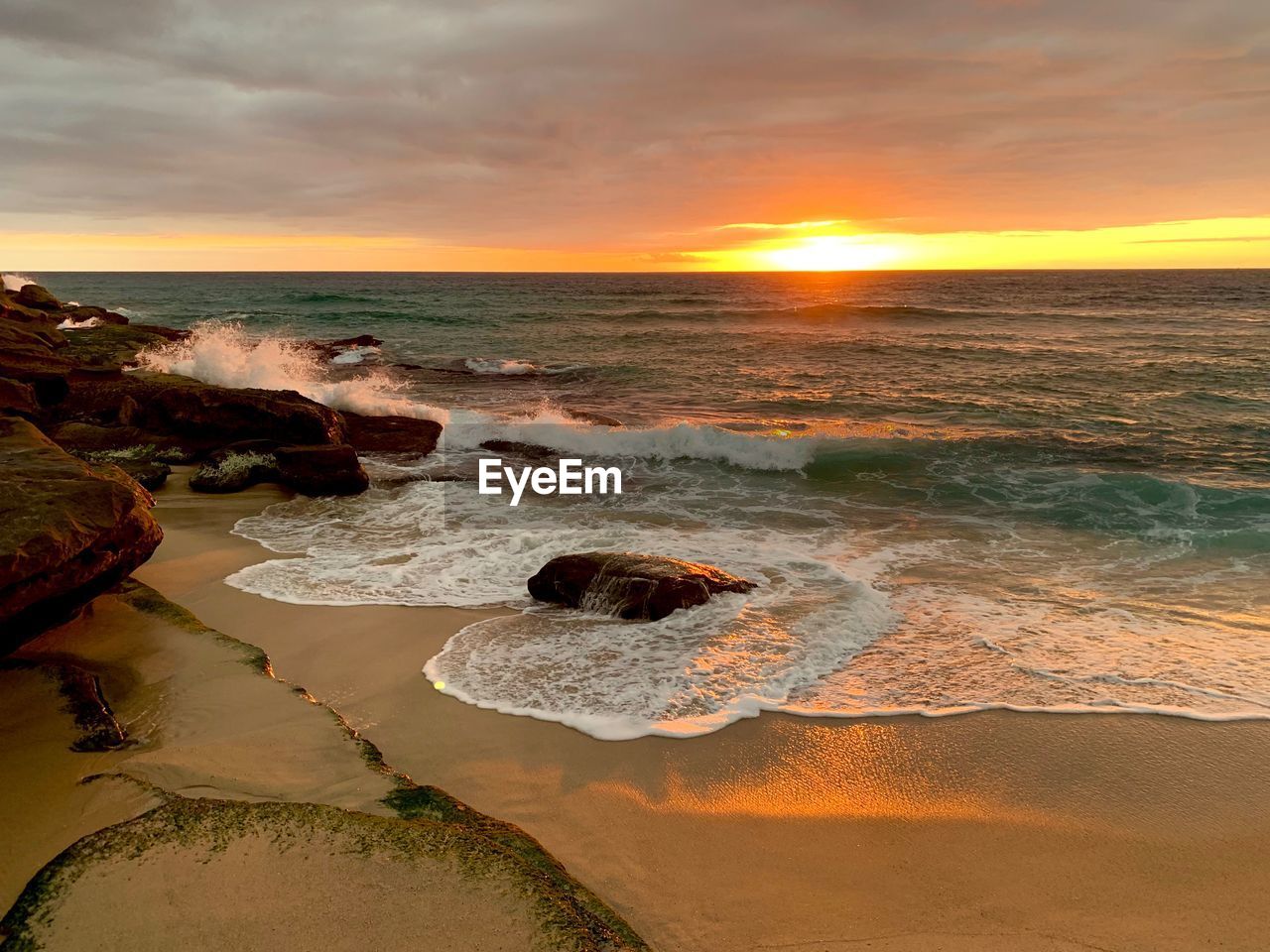 Scenic view of sea against sky during sunset