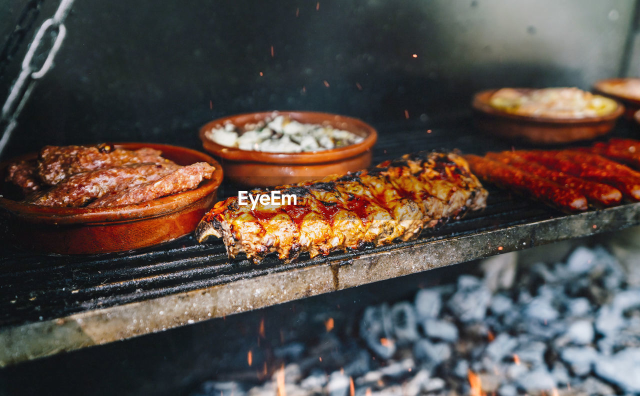 Close-up of meat on barbecue grill