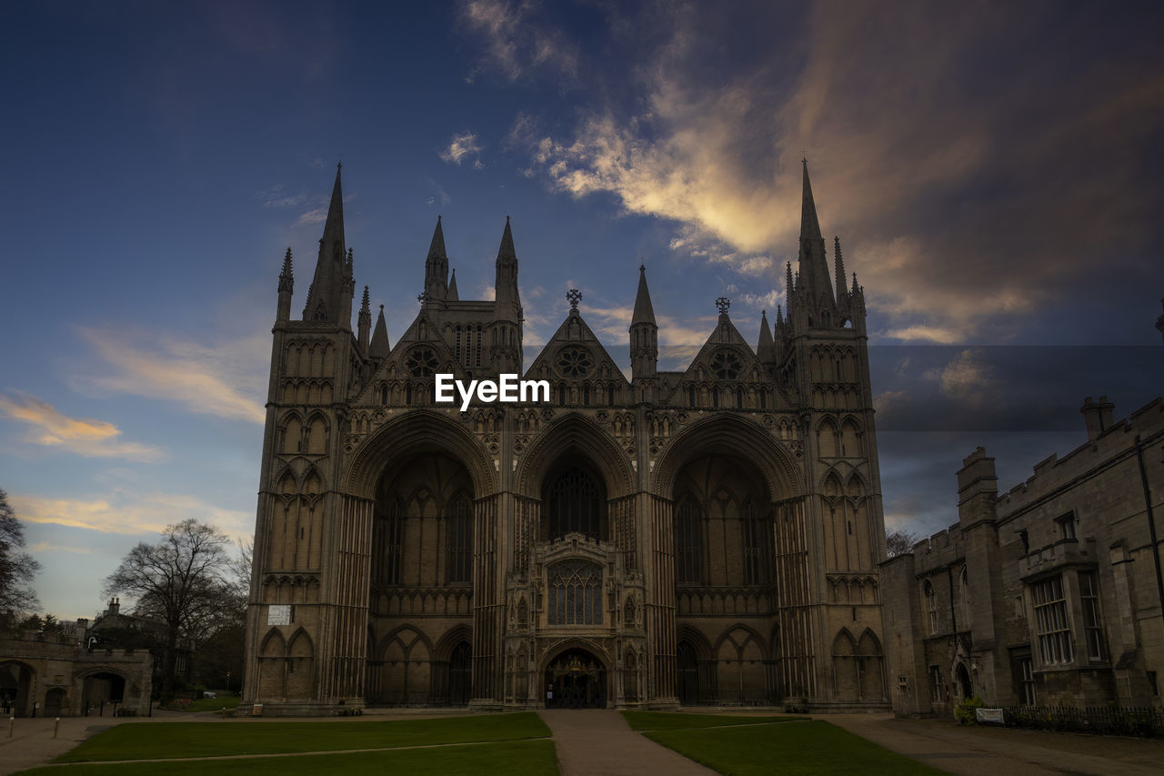 Sunset over the cathedral church of st peter, st paul and st andrew in peterborough, uk