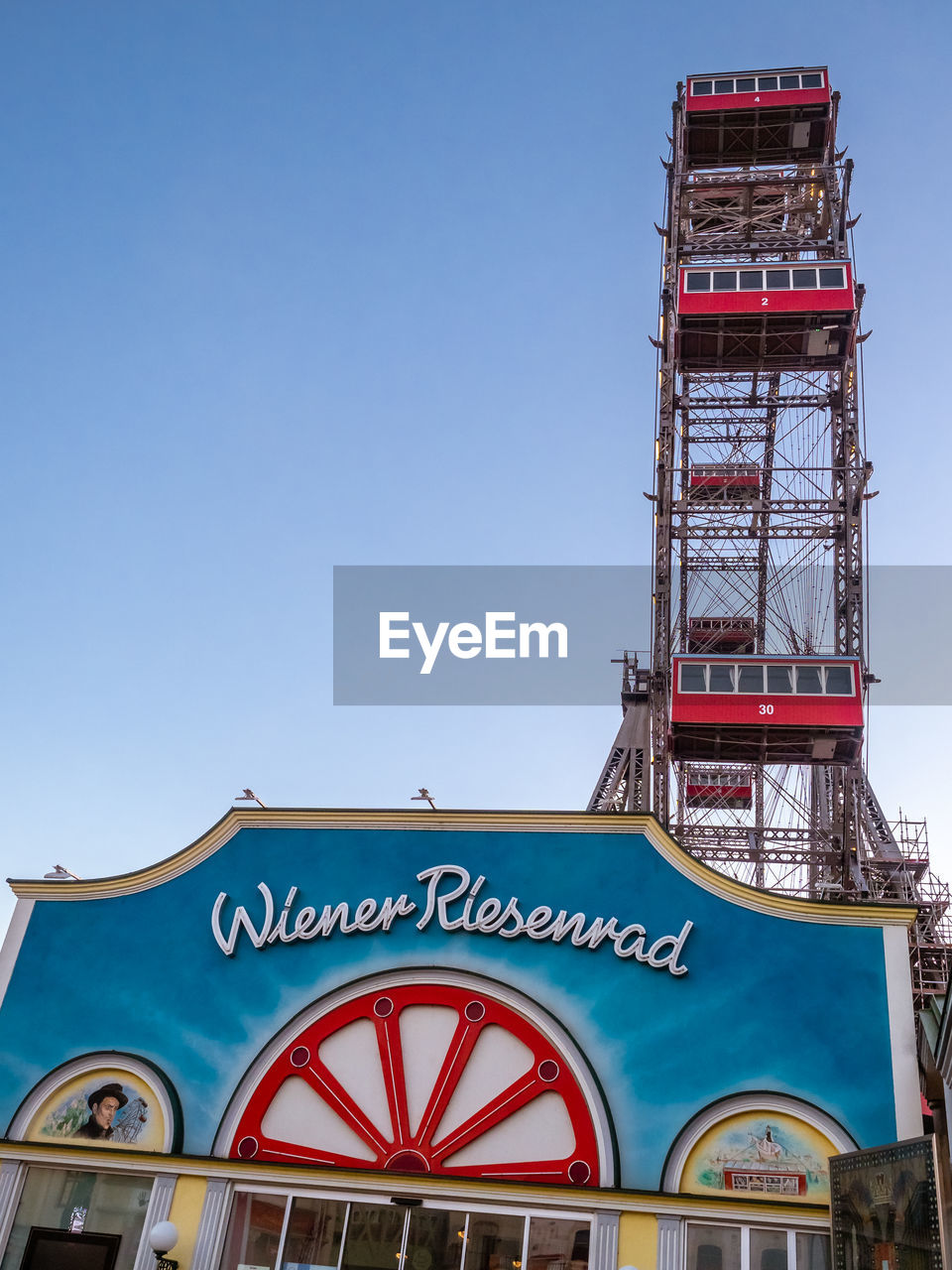 LOW ANGLE VIEW OF INFORMATION SIGN AGAINST BLUE SKY