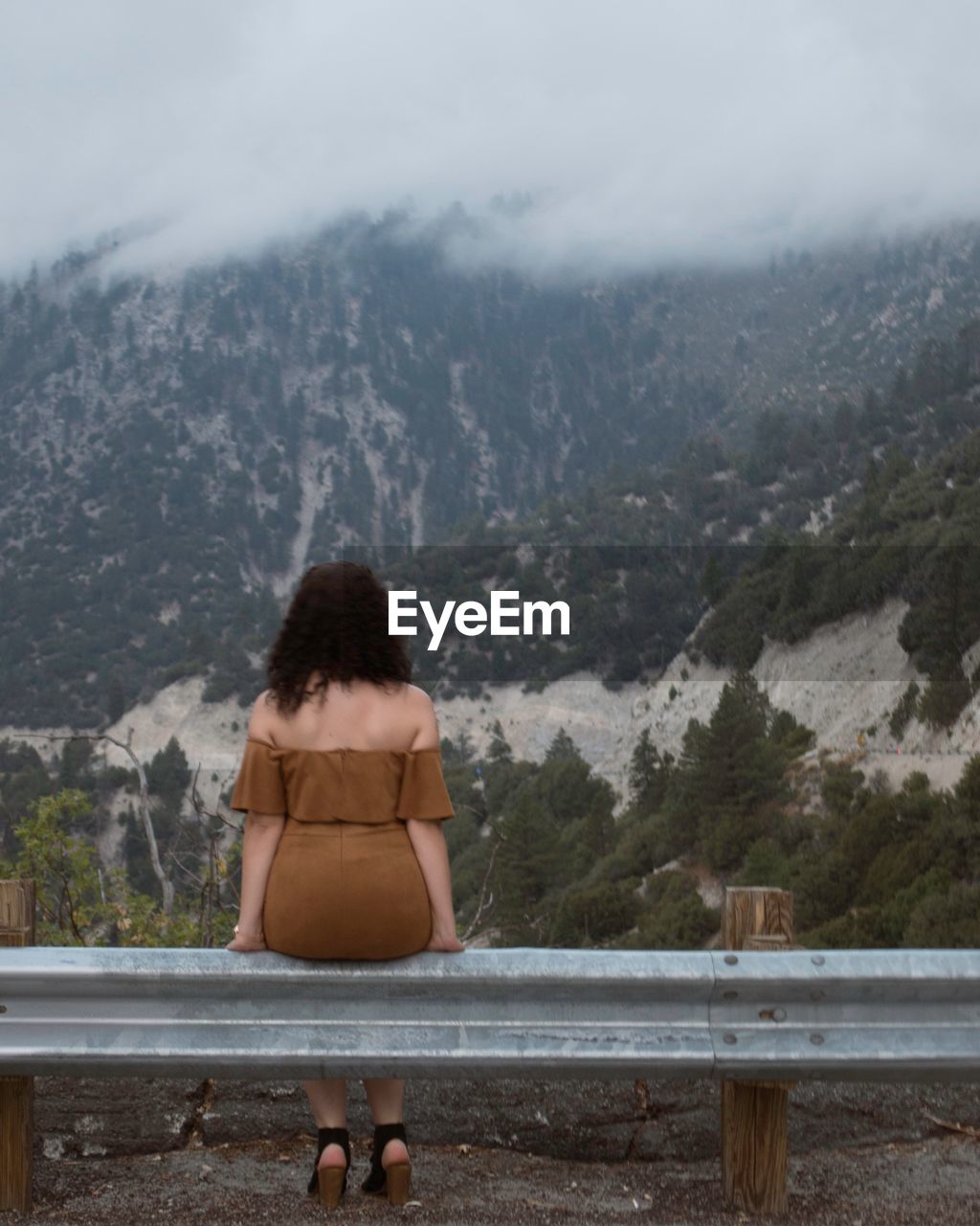 Rear view of woman looking at mountains