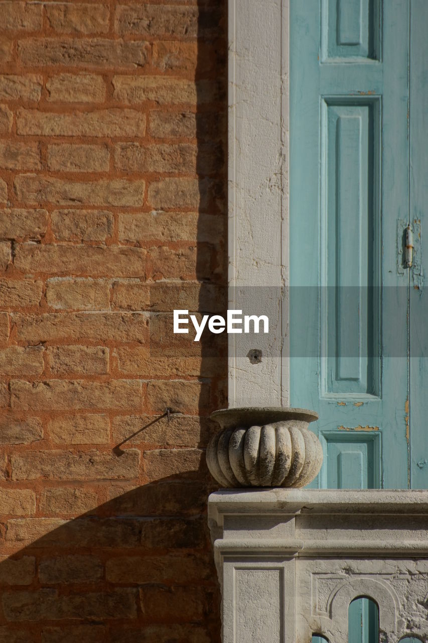 CLOSE-UP OF OPEN DOOR OF BUILDING