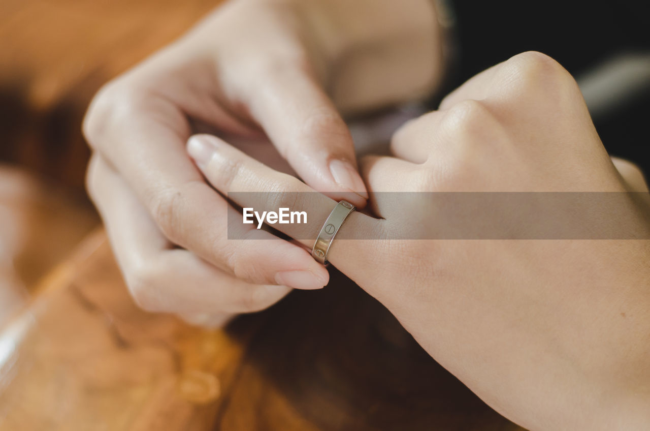 Close-up of woman holding ring