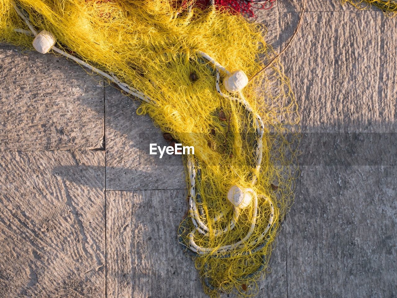 High angle view of fishing net on road